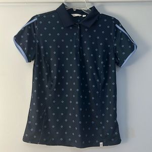 Lady Hagen dark blue collared shirt.